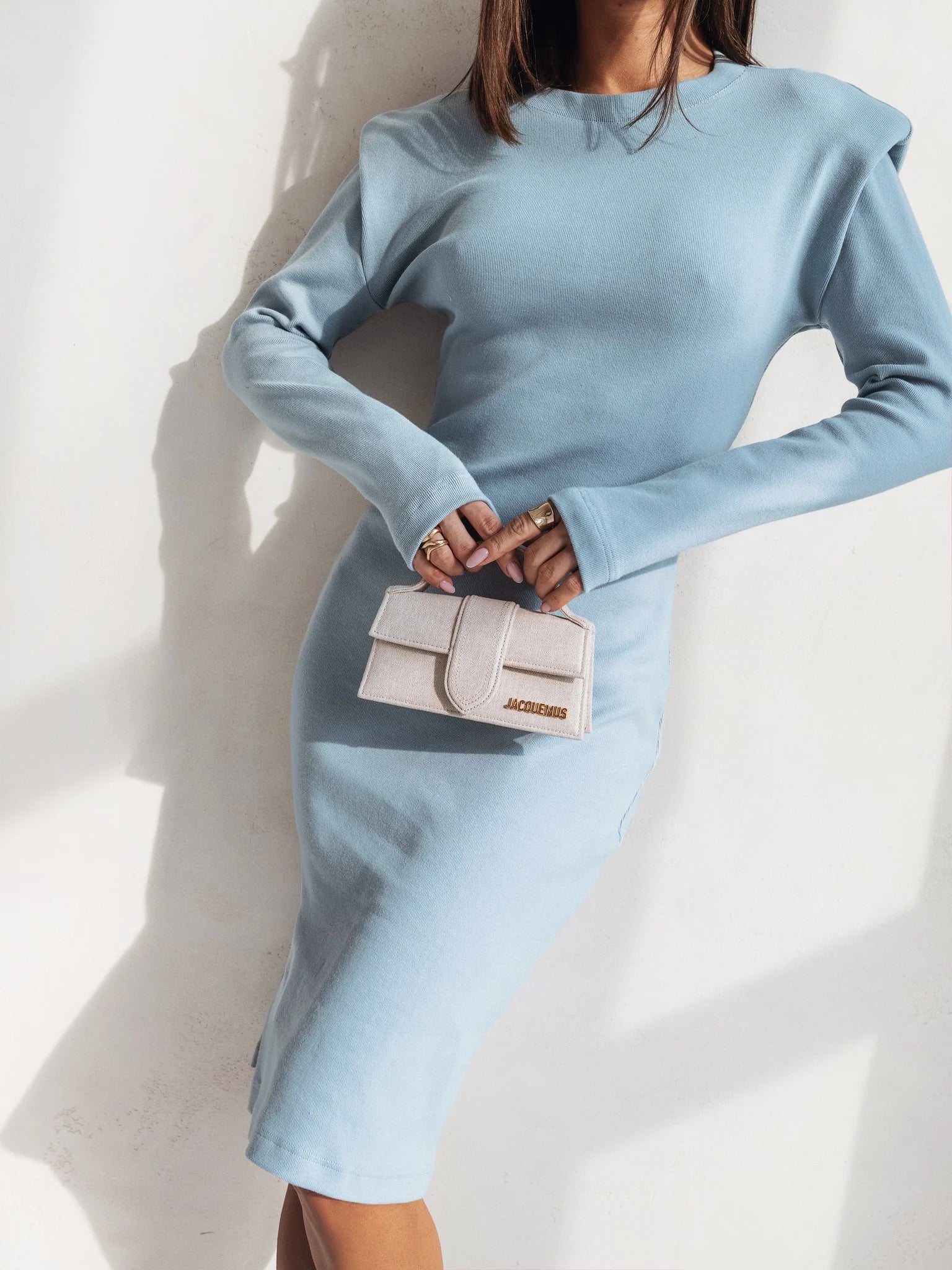 Dress With side slit and padded shoulders